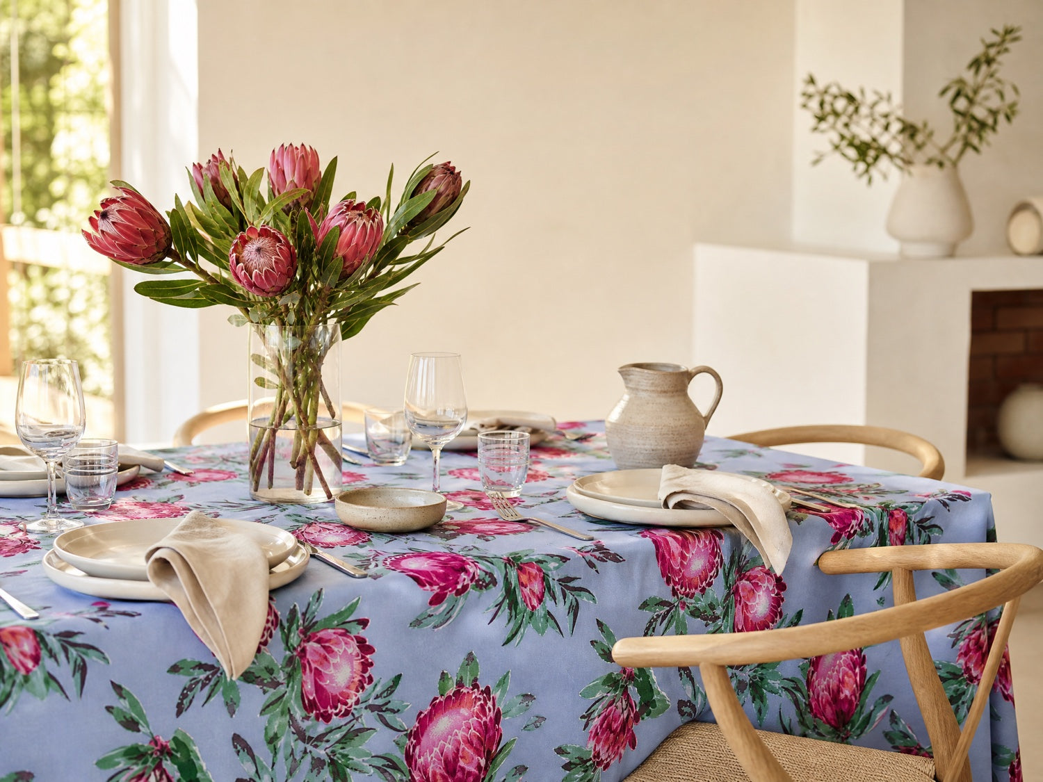 Pink Ice Protea styled on a table