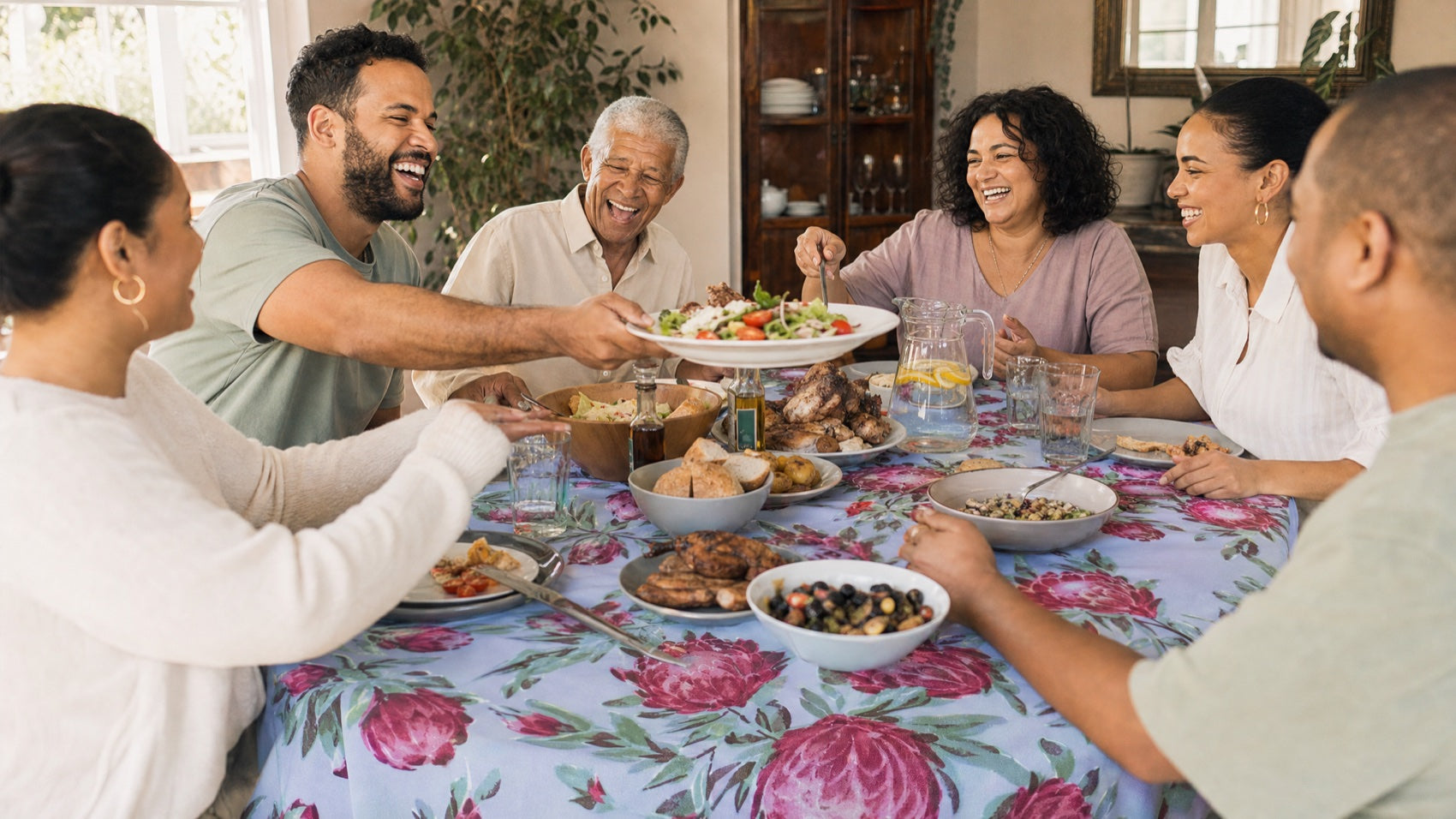 A South African family gathered around a beautifully set table
